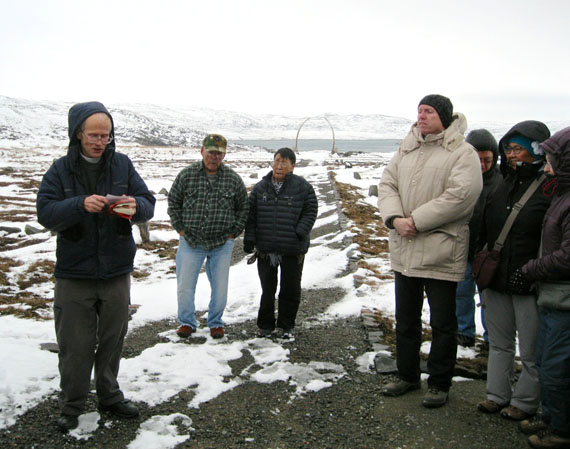 Rev. Mike Gardener, a retired minister from St. Jude’s Anglican Cathedral in Iqaluit, left, blesses Iqaluit’s new municipal cemetery in Apex at a brief opening ceremony Oct. 5. City officials hosted a few dozen residents for a first look at the newly-commissioned site on a blustery Sunday afternoon, followed by a reception at Abe Okpik Hall. Located at the southern edge of Apex, the cemetery’s 3.4-hectare windswept expanse overlooks Tarr Inlet and Frobisher Bay, and replaces Iqaluit’s half-century-old graveyard by Koojesse Inlet in Lower Iqaluit. (PHOTO BY PETER VARGA)