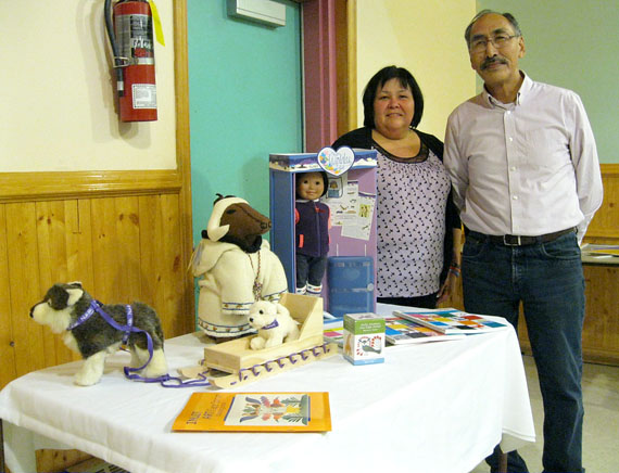 Paul Quassa, the Nunavut minister of education, and Kathy Okpik, the deputy minister of education, displayed some of the teaching materials the territorial government is providing to schools and daycare centres throughout the territory Oct. 1 at the Anglican Parish Hall in Iqaluit. These dolls, books and games, like most new materials, reflect Inuit culture and northern lifestyles, and will go to kindergarten and preschool classes. (PHOTO BY PETER VARGA)