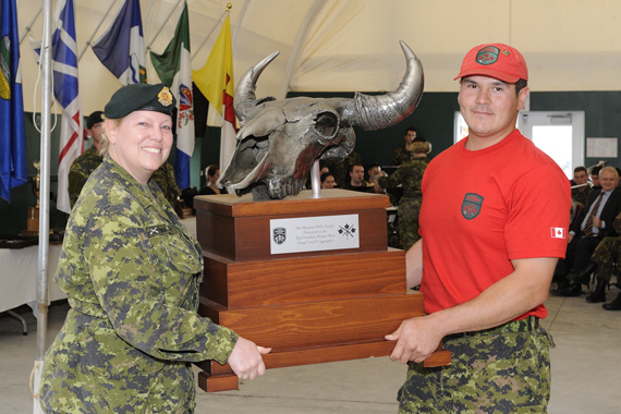 Corporal Jean-Marie Beaulne of the Puvirnituq Canadian Ranger Patrol won the title of best shooter during the Canadian Armed Forces Small Arms Concentration, hosted in Ottawa Sept. 8 - 20. At right, the 28-year-old Ranger receives his trophy from Captain Shannon Wills. (PHOTO BY CPL. PIERRE HABIB/DND)