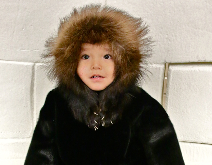 Blake Hatlevik models a traditional coat on loan from the Kitikmeot Heritage Society in advance of an annual gala and auction organized by the Cambridge Bay Daycare Society. This year's event, which will take place Nov. 8 at the Luke Novoligak Community Hall in Cambridge Bay, will celebrate a Winter Wonderland theme. Posters of the daycare children in traditional dress will decorate the hall. (PHOTO BY KELCEY WRIGHT)