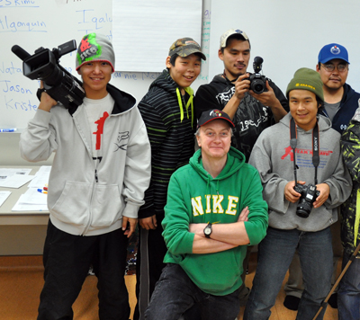 Gordon Billard, in green, is pictured with members of the Arviat Film Society during one of the group’s meetings in his classroom last fall. (PHOTO BY SARAH ROGERS)