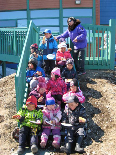 Children at the Kamattsiavik childcare centre in Quaqtaq enjoy a barbecue and picnic last summer. (PHOTO COURTESY OF NUNAVIKCHILDCCARE.CA)