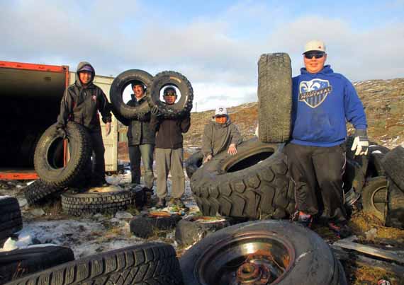 A group of Aupaluk high school students helped collect old tires from the Nunavik community's dump earlier this year to ship south. It's one of a number of recycling pilot projects in place across the region as it plans to launch its new waste management plan in 2015. Read more later at Nunatsiaqonline.ca. (PHOTO BY DOMINIC HAWLEY) 