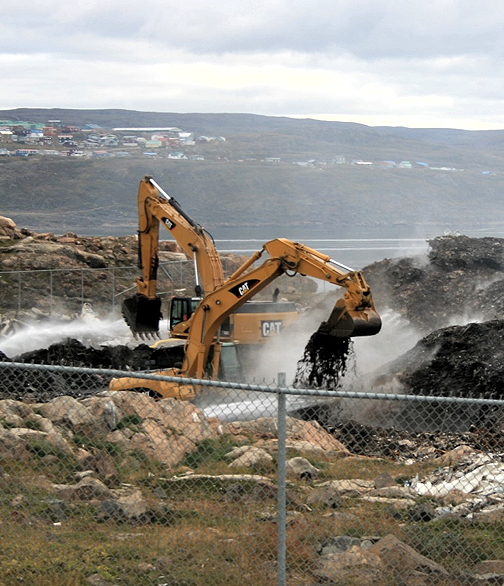 Iqaluit’s dump fire cost the city at least $2.75 million to put out, and left the aquatic centre project short of $1 million. The city will cover the shortfall by digging into its reserve funds. (PHOTO BY PETER VARGA)