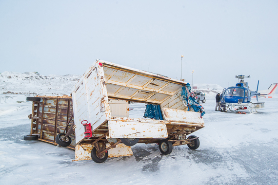 Baggage carts lay strewn and damaged at Salluit's airport Dec. 11, a day after a blizzard kicked up 130 kilometre an hour winds along Nunavik's Hudson Coast. The storm blew panels of roofs, pulled siding from homes and pushed a number of vehicles on their sides. Fortunately, no one in the community of 1,300 was seriously injured during the storm. (PHOTO BY TRISTAN BRAND)