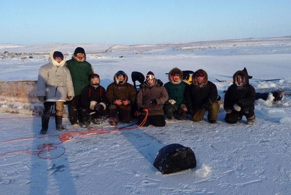 Charlie Pinguartuk, second from left, returned Jan. 10 to the same lake where his skidoo has gone through the ice the night before. After he was rescued by Charlie Ikey, second from right, this group of hunters returned to the site to retrieve Pinguartuk's skidoo the following day. (PHOTO COURTESY OF C. IKEY)