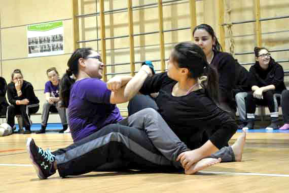 Kuujjuaq high school students Hullik Gadbois and Kim Ford face off in the arm pull event Feb. 26 at Jaanimmarik school. The high school hosted a day of Inuit games for students, handing out medals to the winning athletes. You can read more about the games on the school's website at http;//jaanimmarik.kativik.qc.ca.  (PHOTO BY SARAH ROGERS)
