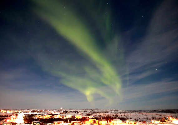 The Northern lights appear a little faded as they compete with the light of a full moon over Kuujjuaq last week. Like much of the Arctic, Nunavik's largest community has been in a deep freeze over the last few days, with the windchill dipping below 50 degrees Celsius. (PHOTO BY GILLES BOUTIN)