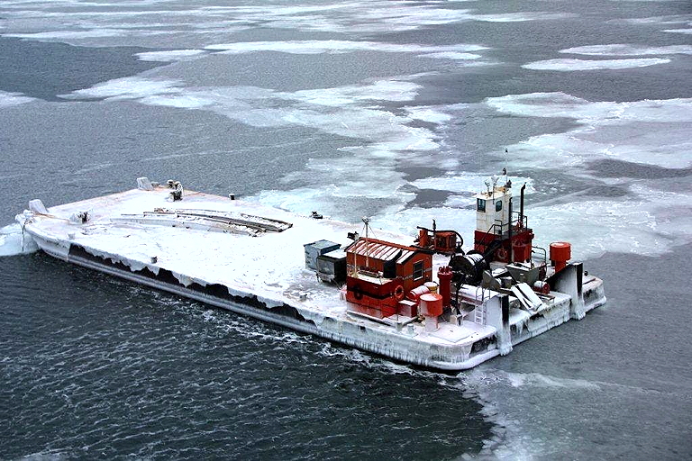 This ice-clad Northern Transportation Co. Ltd. barge is now drifting close to the coast of Russia, says the United States Coast Guard. The 40-metre barge broke loose from its tug last October while en route to Tuktoyaktuk in the Northwest Territories. The barge holds 3,500 litres of diesel fuel for its engines, but no cargo. In November, the U.S. Coast Guard planted a GPS tracker onboard, held in place by sandbags. The barge's progress has surprised some observers because it's travelling up to three knots an hour — about 5.5 kilometres an hour — even through ice. Plans to retrieve the barge may go ahead in the spring. (PHOTO COURTESY OF THE USCG)