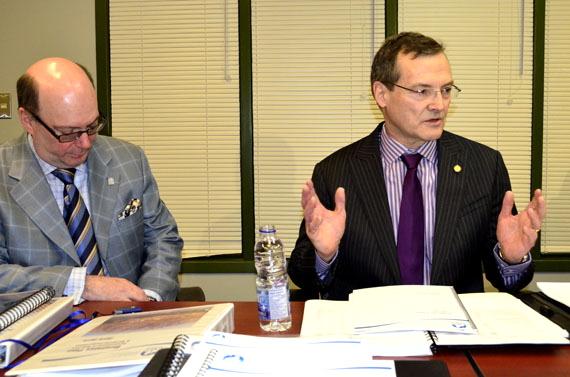 Nunavut Finance Minister Keith Peterson (right) answers questions from reporters Feb. 25 while Chris D'Arcy, the deputy minister of finance, listens in, just a few minutes before Peterson entered the legislative assembly to deliver his 2015-16 budget speech. In the coming fiscal year, Nunavut expects to receive $1.72 billion in revenues and expects to spend $1.673 billion on programs and capital projects, with a $30 million contingency fund and a projected surplus of about $23 million. The Department of Education will get a 10 per cent boost in funding to $203 million and the Department of Health will get a six per cent funding hike, bringing its budget up to $317 million. Read more later on nunatsiaqonline.ca. (PHOTO BY JIM BELL)