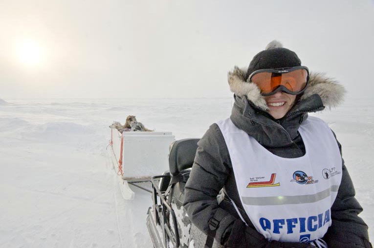 Quebec veterinarian Julie Ducrocq shows off her new dog ambulance, used to transport fatigued, injured or loose dogs taking part in the Ivakkak dog sled race. Ducrocq, who has worked in Nunavik for the past decade, has been Ivakkak’s resident vet for the last five years. Last week, her ambulance carried a record of nine dogs after one team’s qamutik broke apart during the race. As part of the 2015 edition of Ivakkak, a total of ten dog sled teams are working their way north up Nunavik’s Hudson coast this week. Mushers and dogs are resting in Inukjuak March 23, and expected to arrive at the finish line in Puvirnituq March 26. (PHOTO COURTESY OF PIERRE DUNNIGAN/IVAKKAK) 
