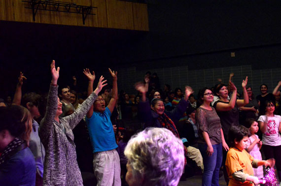 About 500 Ottawa Inuit enjoyed a happy evening March 20, at a spring equinox celebration organized by Tungasuvvingat Inuit, with performances from The Jerry Cans, Saali and the Ravenhearts, Brian Tagalik, and students from Nunavut Sivuniksavut. Here, spectators throw their hands in the air in response to a free T-shirt offer from The Jerry Cans. (PHOTO BY JIM BELL)