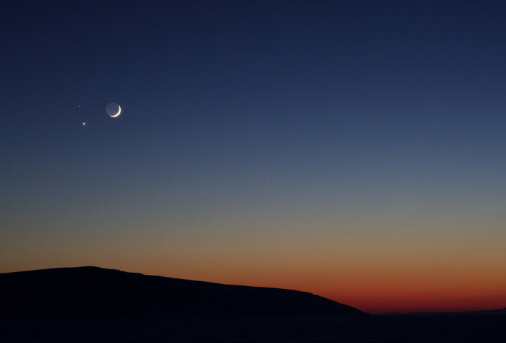 A rare congregation of moon and planets aligned over Arctic Bay Feb. 19 and photographer Clare Kines, who loves the night sky, was bundled up with his tripod to capture the heavenly gathering. It was just after supper and about -35 C when Kines went out with his camera, knowing ahead of time that Mars, the smaller dot, and Venus would be near the crescent moon. He fired off a dozen shots or so and switched lenses to get a tighter image. He said this was shot number two or three. (PHOTO BY CLARE KINES)