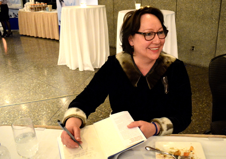 Kuujjuaq-born Arctic environmental campaigner and human rights activist Sheila Watt-Cloutier signs copies of her new book, The Right to be Cold, at A Taste of the Arctic in Ottawa March 10. (PHOTO BY JIM BELL)