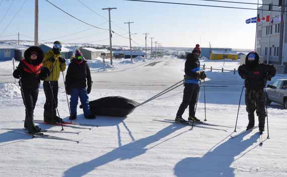 From left, Jaanimmarik student Daisy Gosselin, teachers and coordinators Maxime Saunier and Valérie Raymond, student Eric Lemire and Elijah Thurber-Snowball prepare for cross-country ski training in Kuujjuaq Feb. 28. (PHOTO BY SARAH ROGERS)