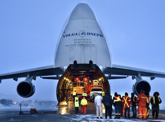April 13 at the Iqaluit airport, crews unload equipment off an Antonov AN-124-100, a huge heavy-lift aircraft intended for the transportation of heavy and oversized cargo and special-purpose vehicles. The aircraft, chartered from the Russian company, Volga-Dnepr, carried equipment needed to restore full and stable power to the community of Pangnirtung, whose power plant burned down April 3. (PHOTO BY KIERAN OUDSHOORN)