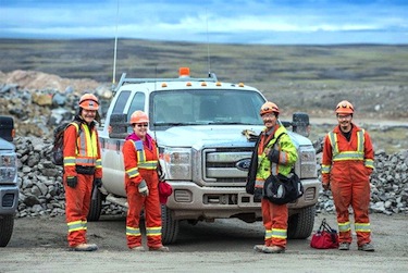 A group of Baffin-based workers stands near the site of Baffinland Iron Mines' Mary River mine site about 160 km southwest of Pond Inlet. From left: Judas Shappa of Arctic Bay, Jenny Nakashuk of Iqaluit, Matthew Taqtu of Arctic Bay and Anakudlak Nowdluk of Iqaluit. (PHOTO COURTESY OF BAFFINLAND)