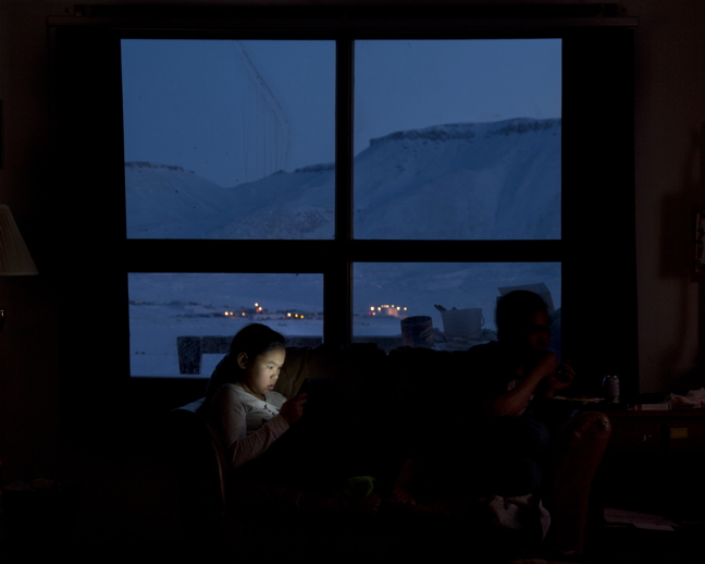 Winter light, both real and artificial: Sipporah Ejangiaq of Arctic Bay surveys a screen in one of 18 photographs currently on display in downtown Ottawa as part of a Fulbright Canada-sponsored exhibition called 