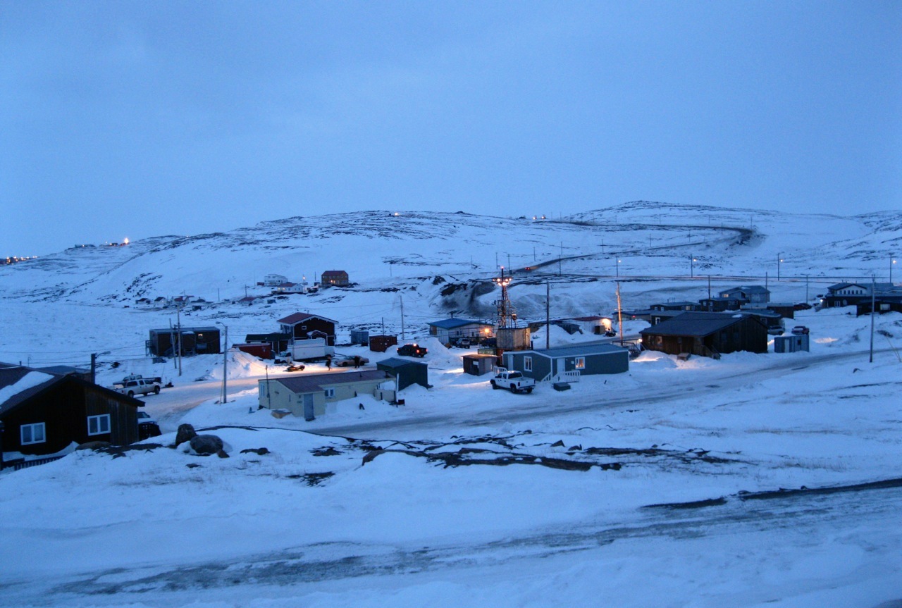 As darkness falls in Apex, April 20, a lighting tower illuminates a section of the community in preparation for overnight shooting for the feature film Two Lovers and a Bear. A production crew led by academy award-nominated director Kim Nguyen will wrap up filming in Iqaluit on April 23, after they are done shooting night scenes in Apex. The Arctic drama stars Tatiana Maslany and Dane DeHaan, who are completing the final outdoor scenes with six other actors. “We’re at work from about 10:30 at night to 3:00 in the morning to get the night shots,” said Iqaluit-based co-producer Ellen Hamilton. The lighting tower, seen at the centre of the photo, has replaced 18 streetlights for the duration of the overnight shooting. Qulliq Energy Corp. will put regular streetlights back on April 23, Hamilton said. (PHOTO BY PETER VARGA)