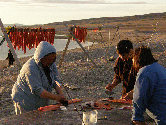 Ruth Eetuk of Coral Harbour snapped this photo of women from the Kivalliq community preparing pipsi on a local beach last summer. 