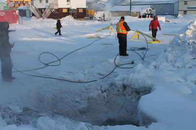 GN employees work to thaw frozen water lines in Rankin Inlet last month. (PHOTO BY NOEL KALUDJAK)