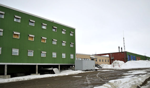 Boarded-up windows, left, are visible where a fire broke out at Nunavut Arctic College’s Ukkivik residence April 24. All student residents and classes on the building’s second and third floors immediately moved out after the fire. A few remaining classes on the ground floor of the building, and the link building in the centre, will wrap up this month and in June. RCMP charged David Etuangat, 34, with arson during their investigation. (PHOTO BY PETER VARGA)