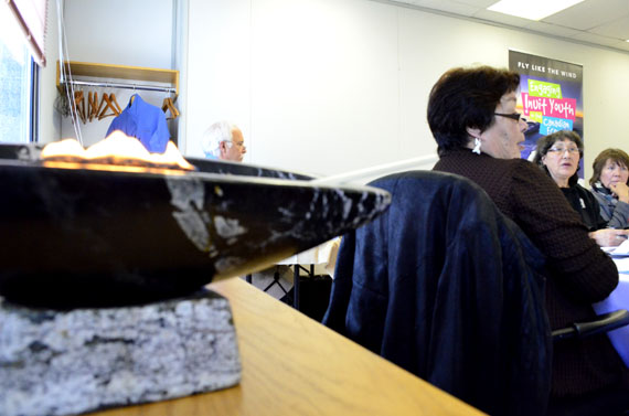 A qulliq flickers at the front of the room as Rebecca Kudloo, the president of Pauktuutit, the Inuit women's association, chairs the first morning of the organization's annual general meeting in Ottawa, which started May 12. Kudloo used her president's report to call for better services to combat family violence in Inuit communities throughout the Arctic, and delegates later had an impromptu discussion on human trafficking. This afternoon, the organization was to name this year's Inuit Woman of the Year award recipient. The meeting continues through the morning of May 13. Read more later on nunatsiaqonline.ca. (PHOTO BY JIM BELL)
