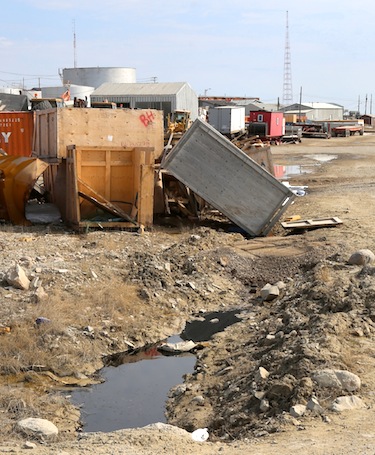 Oil spills can be a mess to clean up — and even worse if they're not: here waste oil sits in a drainage ditch June 2013 near the site of a waste oil spill on the property of Kitnuna Corp. in the western Nunavut town of Cambridge Bay. (FILE PHOTO)
