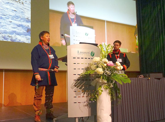Per Henrik Bergkvist from the Jovnevaerie reindeer herding community in northern Sweden speaks June 11 about the experiences that led him to become a suicide prevention activist to an audience at the International Congress on Circumpolar Health. On the right, Jon Petter Stoor of the Saami Norwegian National Advisory Board on mental and health and substance abuse in Norway, who translated for Bergkvist. (PHOTO BY JANE GEORGE)