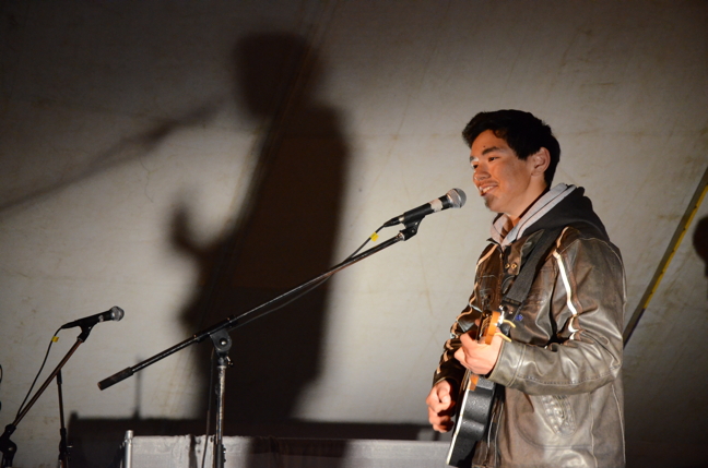 Joshua Haulli plays a final song after he was crowned champion at Alianait's Battle of the Band's June 28. (PHOTO BY DAVID MURPHY) 