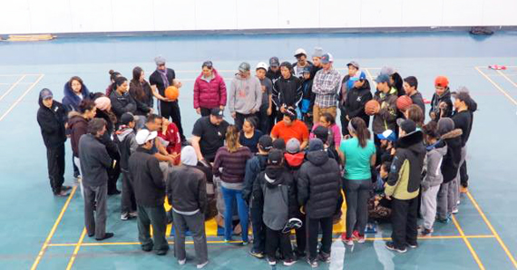 Athletes from across the Hudson coast gather to watch hand games during coastal trails in Inukjuak last month. (PHOTO COURTESY OF TNQ)