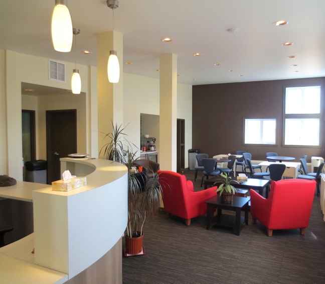 The modern lobby of the new Naujaaraaluit Hotel. The space will soon feature local artwork and photos of Ilisaqsivik programs, to highlight the different activities and services that hotel profits go to support. The hotel encourages local residents to enjoy the lobby as well, offering coffee, tea, and bannock, as well as cable TV and games. (PHOTO COURTESY ILISAQSIVIK)