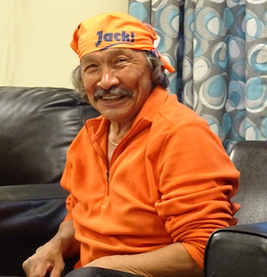 NDP candidate Jack Anawak dons a scarf reading 