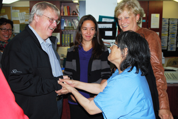 Quebec health minister Gaétan Barrette, left, shakes hands with veteran Nunavimmiut midwife Leah Tulugak-Qinuajuak Sept. 1 at the Inuulitsivik health centre in Puvirnituq, as part of his two-day tour of the region. (PHOTO BY BEN WATT/NRBHSS)