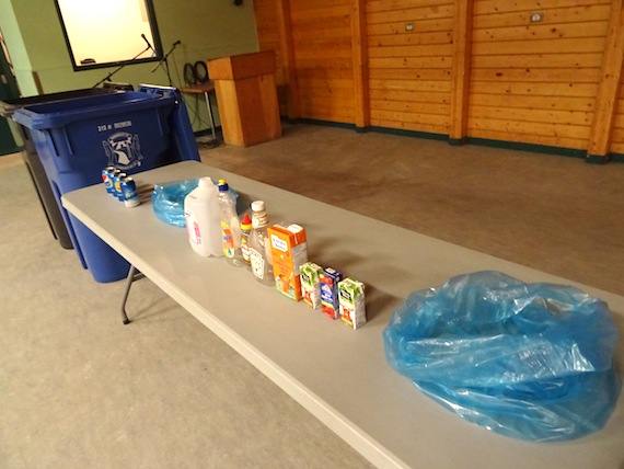 Recyclable items and the new bins are on display at the Luke Novoligak community hall in Cambridge Bay Sept. 30. (PHOTO BY JANE GEORGE)