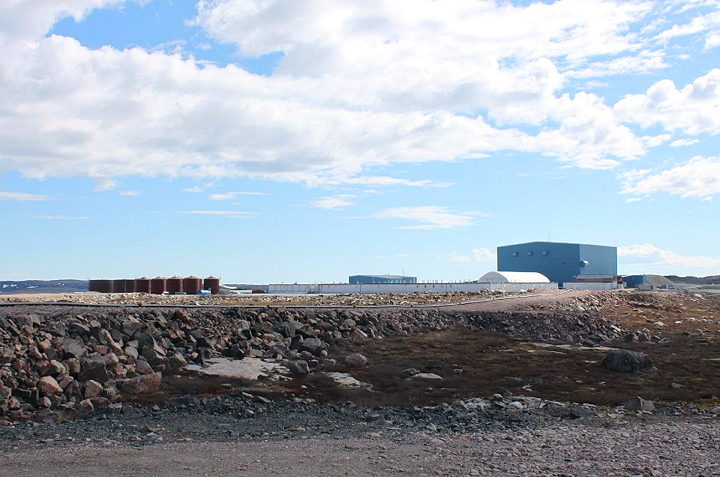 A June 2015 photo of the abandoned Jericho Diamond Mine about 350 kms south of Cambridge Bay shows the mill — the large blue building — where a pair of nuclear gauges have been stored for years, unbeknownst to the mine's current stewards, Indigenous and Northern Affairs Canada. (PHOTO COURTESY NIRB)