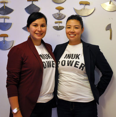 Nunavik youth forum president Alicia Aragutak with vice-president Louisa Yeates wearing Inuk Power t-shirts, a phrase they hope will connect youth in the region. (PHOTO BY SARAH ROGERS)