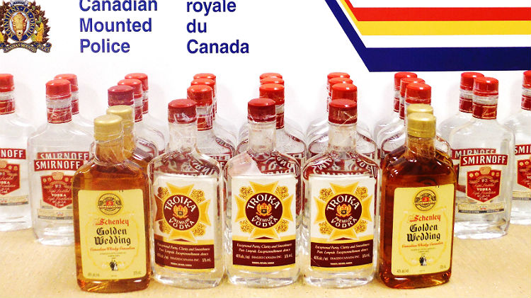 This Yellowknife RCMP photo shows some of vodka and whiskey, bound for Kugaaruk, that police seized Dec. 22 at the Yellowknife airport. (PHOTO COURTESY OF THE RCMP)