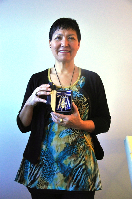 Leena Tatiggaq Evic displays the Meritorious Service Cross she received from Governor General David Johnston at a ceremony at Rideau Hall in Ottawa, Dec. 11. Evic was recognized for her language and cultural instruction enterprise Pirurvik, which she launched with a partner in 2004. (PHOTO BY THOMAS ROHNER)