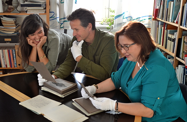 Darren Keith and Pamela Gross work with National Museum of Denmark staff to identify Inuit in historic photos taken during Knud Rasmussen's Fifth Thule Expedition. (PHOTO BY BRENDAN GRIEBEL)