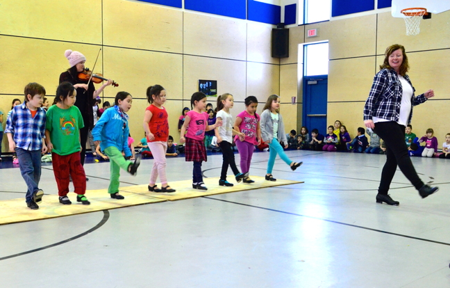 Kuujjuaq youngsters get a chance to learn step-dancing during after-school workshops at the youth centre put on by the Searson Band sisters. The sisters then invited their students to put on a performance Dec. 4 at Pitakallak School. Three different groups got an opportunity to perform — those seven and under, those eight and up and a group of beginners who wanted to try it out. Here, the under seven group shows the audience how it's done. (PHOTO BY ISABELLE DUBOIS)