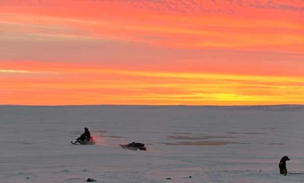 A hunter crosses the bay around 1:30 p.m. on Dec. 20, near Cambridge Bay in western Nunavut. Though the sun had basically disappeared by then, it still shone from below the horizon, setting the cloudy sky on fire in shades of yellow and orange and casting a warm glow on residents below. The Iqaluit and Ottawa offices of Nunatsiaq News will close Jan. 1 for the New Year's Day holiday. We would like to thank all our contributors, especially our talented community photographers, including Sarah Meeko, Niore Iqalukjuak, Denise Lebleu, Isabelle Dubois, Jesse Ajayi, Clare Kines, Noel Kaludjak, Derrick Anderson, Frank Reardon, Valter Botelho, David Kilabuk, Doug McLarty, Eric Anoee, Paul Aningat, Claude Constantineau and others. We'd also like to wish our readers and followers a safe and happy New Year and we hope you enjoy your long weekend. Our Jan. 1, 2016 newspaper should be available for pick up by Jan. 2 at the usual locations in your community. We'll be back to regular office hours Jan. 4. (PHOTO BY DENISE LEBLEU)