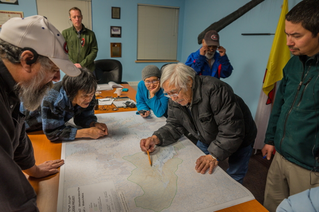 Local holders of knowledge in Naujaat chat with Parks Canada officials as part of the Ukkusiksalik National Park Inuit Knowledge Working Group in Naujaat late last month. The working group met from Jan. 25 to 27 to discuss a number of projects related to the park including marine baseline data collection, a climate change vulnerability assessment, and the use of Inuit knowledge to monitor park health. (PHOTO COURTESY JOVAN SIMIC/PARKS CANADA)
