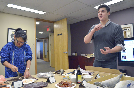 It's the best food you can eat. Looee Okalik (left) and Robert Comeau prepare samples of country food Feb. 29 at the Inuit Tapiriit Kanatami's Ottawa office to give media an advance look at some of the tasty Arctic treats that ITK will feature at its March 7 Taste of the Arctic entertainment event at the National Arts Centre. The evening will feature DJ Geronimo Inutiq of Montreal, The Trade-offs, and the Nunavut Sivuniksavut square dance band, along with generous servings of Arctic country foods. To get a $99 early rate ticket at the URL www.itk.ca/atota, Nunatsiaq Online readers can use this code: 2016-FriendsFamilyRate50. (PHOTO BY JIM BELL)