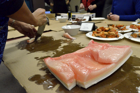 Looee Okalik slices beluga mattaak into cubes Feb. 29 at the Inuit Tapiriit Kanatami's Ottawa office. ITK will feature many different country foods at its Taste of the Arctic entertainment event at the National Arts Centre, from 6 p.m. to 10 p.m. The evening will feature DJ Geronimo Inutiq of Montreal, The Trade-offs, and the Nunavut Sivuniksavut square dance band, along with generous servings of Arctic country foods. To get a $99 early rate ticket at the URL www.itk.ca/atota, Nunatsiaq Online readers can use this code: 2016-FriendsFamilyRate50. (PHOTO BY JIM BELL)