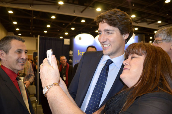 Prime Minister Justin Trudeau's appearance Jan. 28 at Northern Lights 2016 produced a minor sensation as scores of fans milled around to shake his hand and pose for selfies, like this one with Mona Godin, manager of DJ Specialties in Iqaluit and president of the Iqaluit Chamber of Commerce. Northern Lights organizers said Trudeau's visit — the first from a sitting prime minister — gave the event an enormous boost last week. (PHOTO BY JIM BELL)