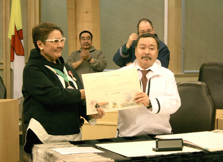 Pauloosie Keyootak, seen here Feb. 24 taking his oath of office as the new MLA for Uqqummiut, has been reported overdue after departing Iqaluit March 22 by snowmobile for Pangnirtung, along with two companions. The group did not arrive when expected March 24. On March 27, sources informed Nunatsiaq News that two searchers from Iqaluit have headed out along the Pangnirtung trail and that the search and rescue group in Pangnirtung is preparing to take part. A spokesperson for Nunavut's emergency management organization said March 27 it is not their policy to comment on a search while the search is underway. As of the morning of March 28, the overdue travellers had not turned up.  (FILE PHOTO)