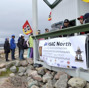 PSAC members line up for food at a 2013 Labour Day picnic at Sylvia Grinnell Park. PSAC officials will hold a rally at Iqaluit City Hall at 10:00 a.m. today to burn a letter the city sent this week to its unionized employees. Read more later. (FILE PHOTO)