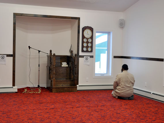 An Iqaluit Muslim prays March 1 in the men’s prayer room at the community’s new mosque. (PHOTO BY SARAH ROGERS)