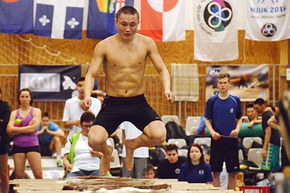 Sergei Khudi, a 17-year-old reindeer herder from Yamal, obliterates his competition March 9 in the Arctic Winter Games' open male sledge jump with 350 completed attempts, continuing the long trend of Yamal dominance in the discipline. While it secured Khudi the gold ulu with ease, he's still a long way off from winter games record holder and past teammate, Rodin Roaldovich Taligin who completed 830 jumps in the 2006 Alaska games.The next best sledger was silver medalist Denis Longortov, also from Yamal, with 240 jumps. This year's games wrap up March 11. (PHOTO BY STEVE DUCHARME)